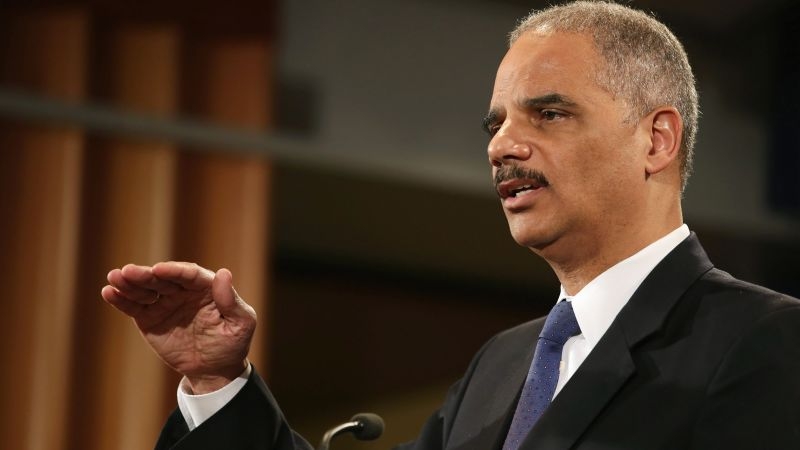 Holder subtly knocks Sanders on guns