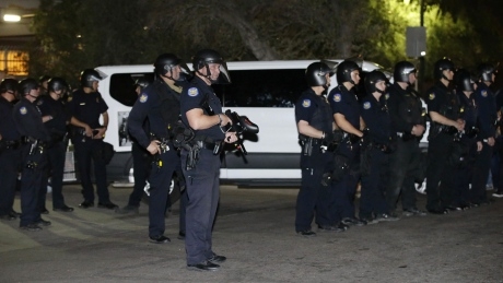 Police confront protesters at Phoenix Immigration office