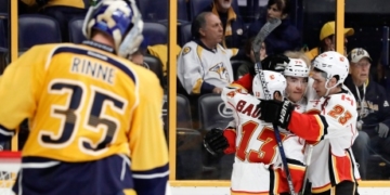 Flames blow lead, rally back to down Preds in OT