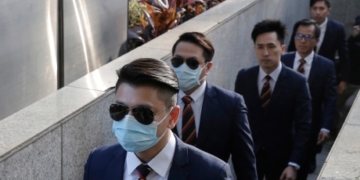 Hong Kong police officers sentenced to prison in beating of activist
