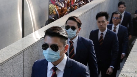 Hong Kong police officers sentenced to prison in beating of activist