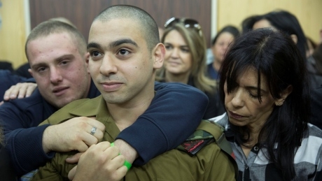 Israeli soldier who shot prone Palestinian assailant, sentenced to 18 months