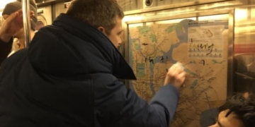 New York City commuters team up to clean Nazi graffiti in subway car