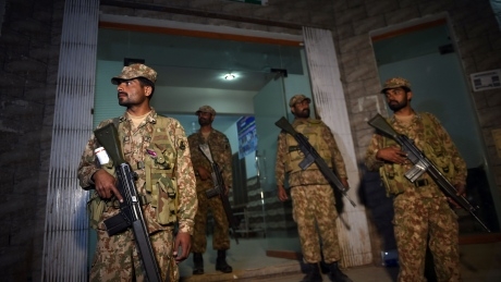 Pakistan security forces go on offensive in raids a day after shrine bombing