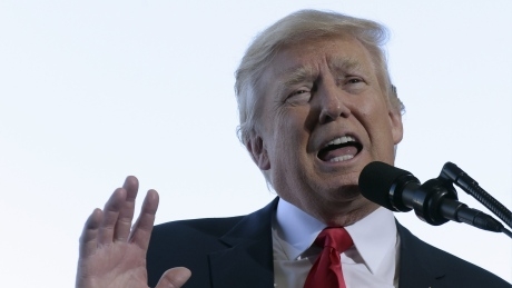 Trump slips back into campaign mode with Florida rally