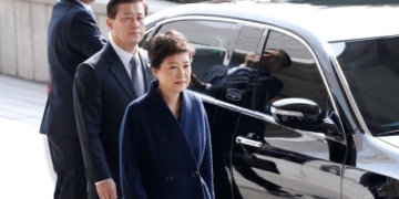 South Korea’s ousted president arrives for questioning, apologizes