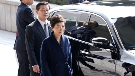 South Korea’s ousted president arrives for questioning, apologizes