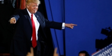 Trump blames China for campaign hacking, warns over North Korea