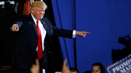 Trump blames China for campaign hacking, warns over North Korea