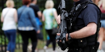 U.K. lowers threat level as 2 more bomb suspects arrested