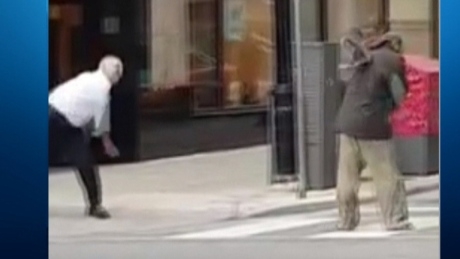 Security guard suspended after video shows him throwing shoes at a homeless man
