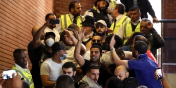 ‘We want justice’: Families of London fire victims storm town hall