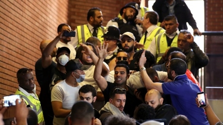 ‘We want justice’: Families of London fire victims storm town hall