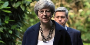 Beleaguered U.K. prime minister names new cabinet as critics circle