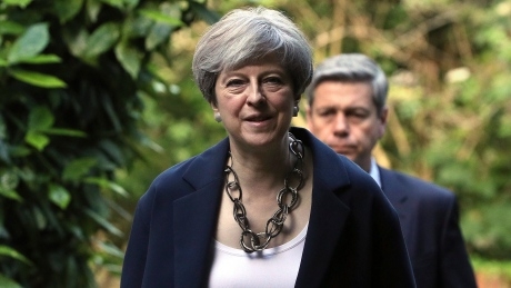 Beleaguered U.K. prime minister names new cabinet as critics circle