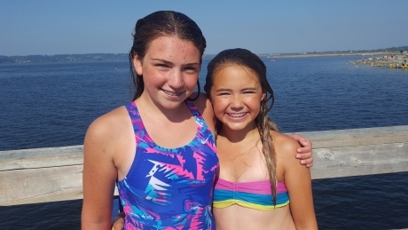 11-year-old girls rescue 2 struggling swimmers in Surrey