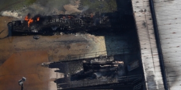 What are the chemicals burning at a flooded Texas plant?