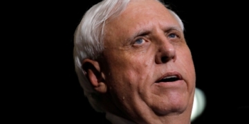 West Virginia governor jumps from Democrats to Republicans at Trump rally