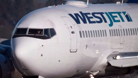 De-icing spray leak into WestJet plane at Calgary airport sends crew member to hospital