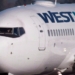 De-icing spray leak into WestJet plane at Calgary airport sends crew member to hospital
