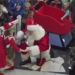 Santa arrives by Indycar, helicopter