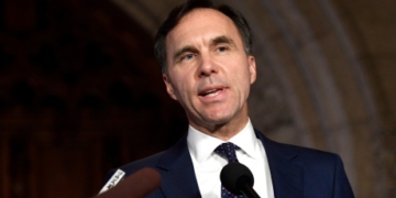 Morneau says he’s sold all shares in family’s pension company, made donation to charity