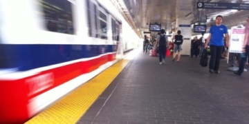 Woman hurt by SkyTrain car while running on platform