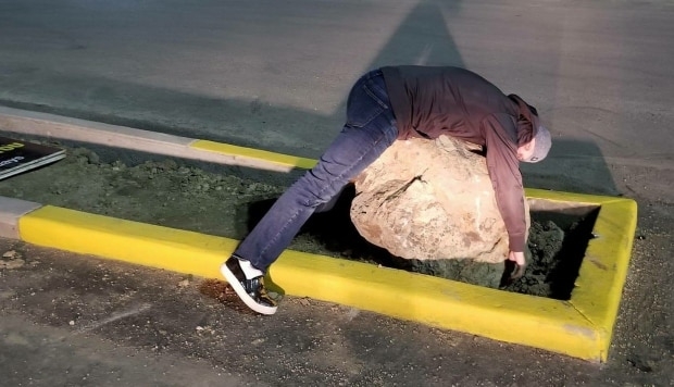 Drivers keep hitting large rock in suburban Calgary parking lot