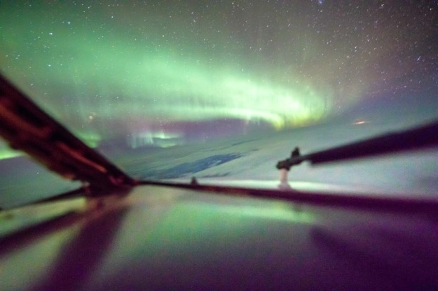 Flying through northern lights 'really surreal' for Calgary photographer