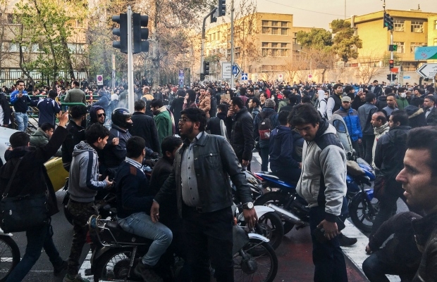Iran state TV says 9 more killed as protests continue for 6th day
