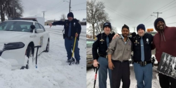 Men help troopers free police car from snowbank