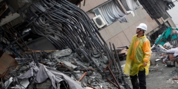 Rescuers search tilted building in Taiwan as quake death toll hits 10