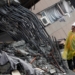 Rescuers search tilted building in Taiwan as quake death toll hits 10