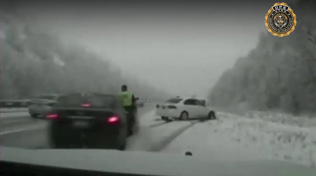 Utah trooper hit by skidding car