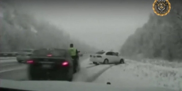 Utah trooper hit by skidding car
