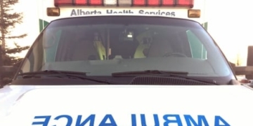 Vehicle hits 2 pedestrians, killing woman and critically injuring man