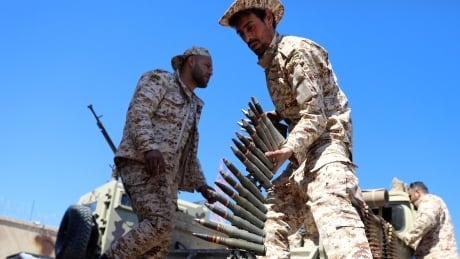 Tripoli under attack as Libyan power struggle escalates, international groups pull out