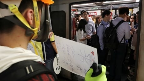 Hong Kong protesters take to the subway, as China confirms U.K. consulate employee detained