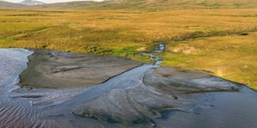 As climate change melts Alaska’s permafrost, roads sink, bridges tilt and greenhouse gases release