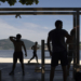 AP PHOTOS: Isolated fitness fans turn to Internet, outdoors