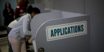 Record 6.6M Americans filed for jobless benefits last week