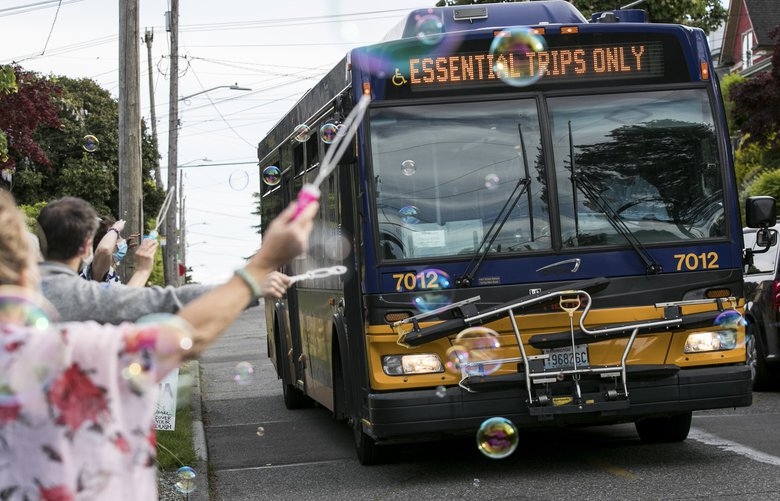 ‘The Ride of Pride’: Seattle neighbors offer a weekly salute to Metro bus drivers with bubbles and joy