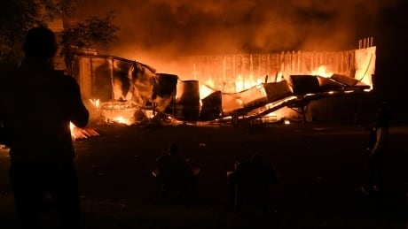 Fires burn in Minneapolis as protests rage over George Floyd’s death