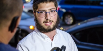 ’All of the glass hit me. But the bullet didn’t’: Innocent bystander dodges death by inches after driving into Brooklyn shootout