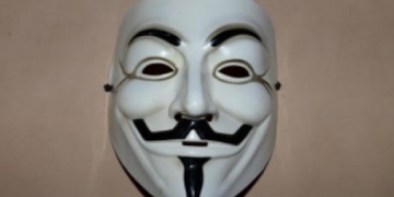 Man in Guy Fawkes mask threatened police with knife before fatal shooting, inquest hears