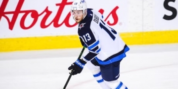 Dubois scores twice including OT winner to lift Jets past Canucks