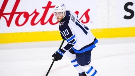 Dubois scores twice including OT winner to lift Jets past Canucks