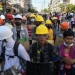 Defying deadly crackdown, protesters in hard hats and goggles clash with riot police in Myanmar