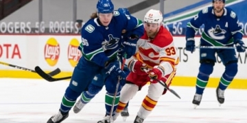 Canucks game against Flames called off with 2 players, coach in COVID-19 protocols