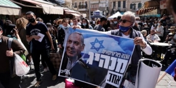 Netanyahu tries to inoculate himself against defeat as Israel's voters head to polls in pandemic